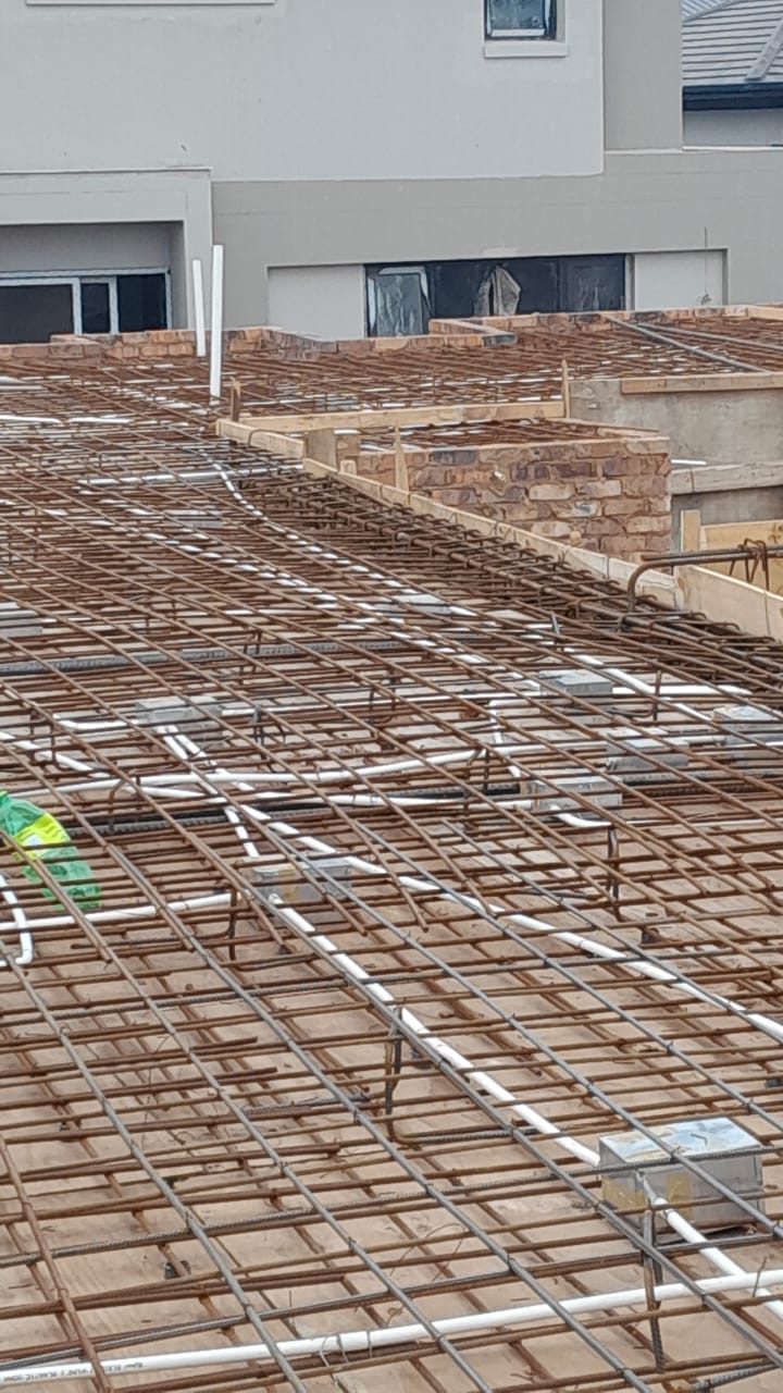 Steel reinforcement mesh laid over rib-and-block slab decking